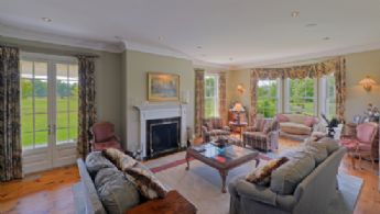 Living Room with Fireplace - Country homes for sale and luxury real estate including horse farms and property in the Caledon and King City areas near Toronto