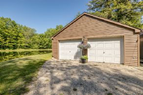 Garage by log house - Country homes for sale and luxury real estate including horse farms and property in the Caledon and King City areas near Toronto