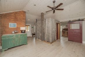 Mudroom with walk-in closet, laundry room & powder room - Country homes for sale and luxury real estate including horse farms and property in the Caledon and King City areas near Toronto