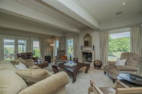 Living room with fireplace - Country homes for sale and luxury real estate including horse farms and property in the Caledon and King City areas near Toronto