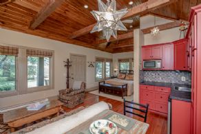 Guest house interior with bedroom, bathroom, sitting area and kitchenette - Country homes for sale and luxury real estate including horse farms and property in the Caledon and King City areas near Toronto