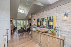 Front foyer with brick accent wall - Country homes for sale and luxury real estate including horse farms and property in the Caledon and King City areas near Toronto