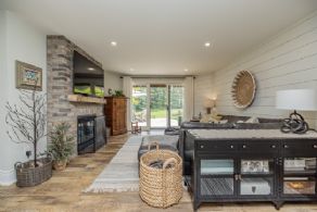 TV room with walk-out to stone patio - Country homes for sale and luxury real estate including horse farms and property in the Caledon and King City areas near Toronto