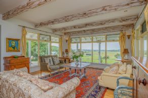 Living Room with Beamed Ceiling - Country homes for sale and luxury real estate including horse farms and property in the Caledon and King City areas near Toronto
