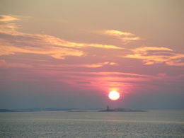 Sunset behind Evelyn Island lighthouse - Country homes for sale and luxury real estate including horse farms and property in the Caledon and King City areas near Toronto