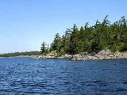 View of west shoreline and front dock - Country homes for sale and luxury real estate including horse farms and property in the Caledon and King City areas near Toronto